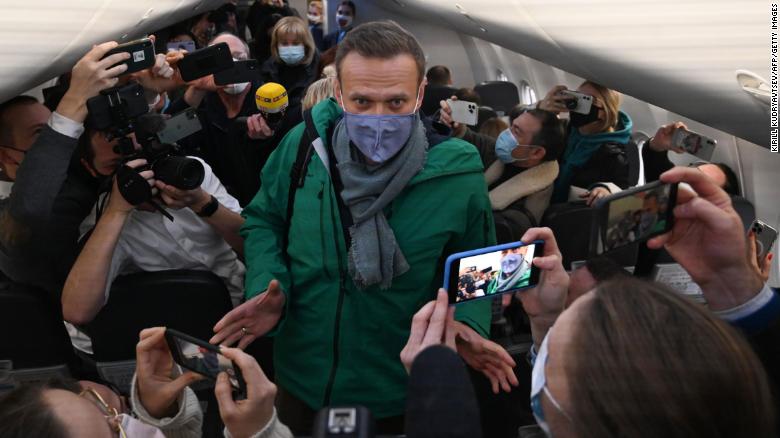 Alexei Navalny with journalists as he prepares to leave for Moscow from Berlin